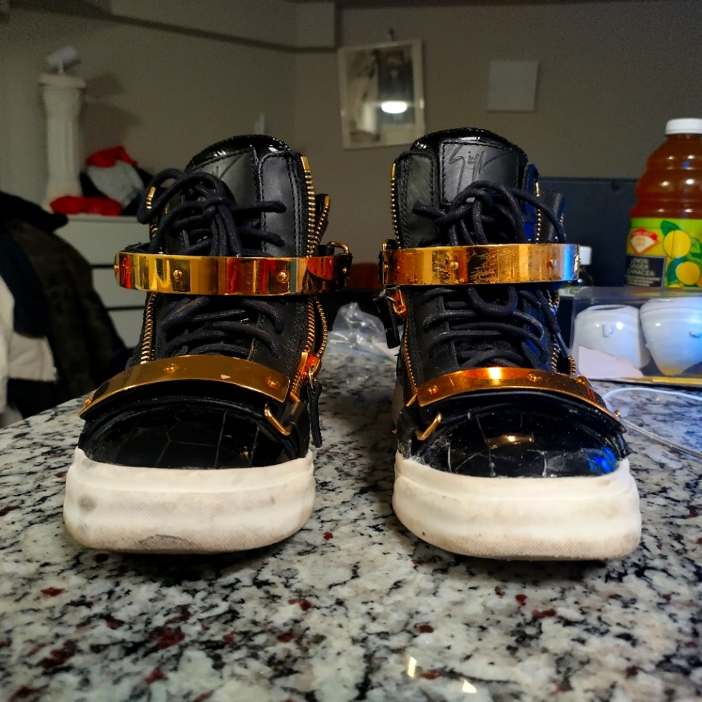 Giuseppe zanotti double buckle snakeskin shoes.